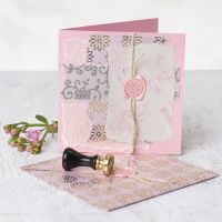 A Greeting Card decorated with handmade Paper, printed Designs, Wax and Seal