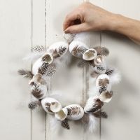 A wreath with plastic eggs and guinea fowl feathers