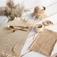 Place mats knitted from paper raffia with tassels