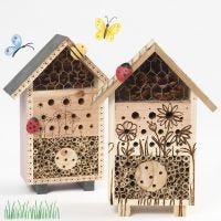 An insect hotel or a bug's b&b decorated with a pyrography tool and painted stones.