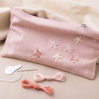 Clutch bag with embroidered butterflies