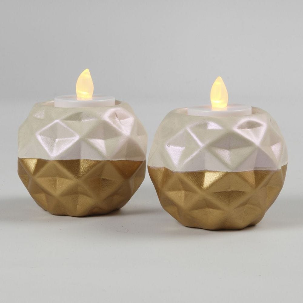 A Candle Holder from white Terracotta painted with Gold and Mother-of Pearl Paint