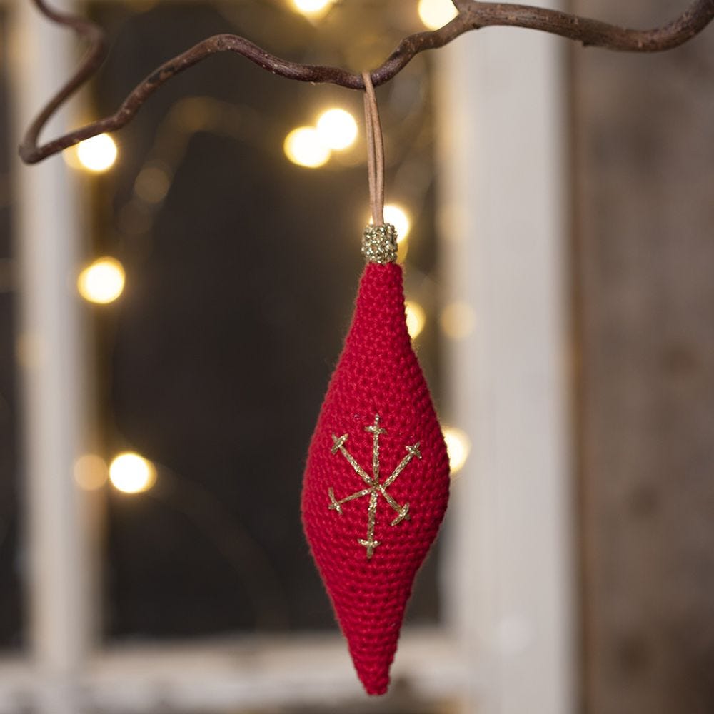 An oblong Christmas hanging decoration crocheted from cotton yarn