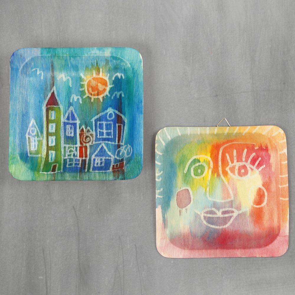 Pictures on wooden plates with watercolours and drawing gum